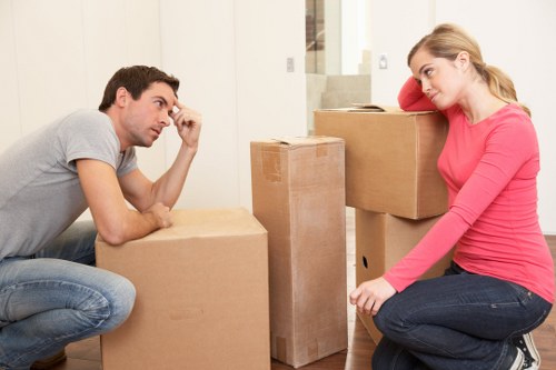 Team handling furniture during move in Putney